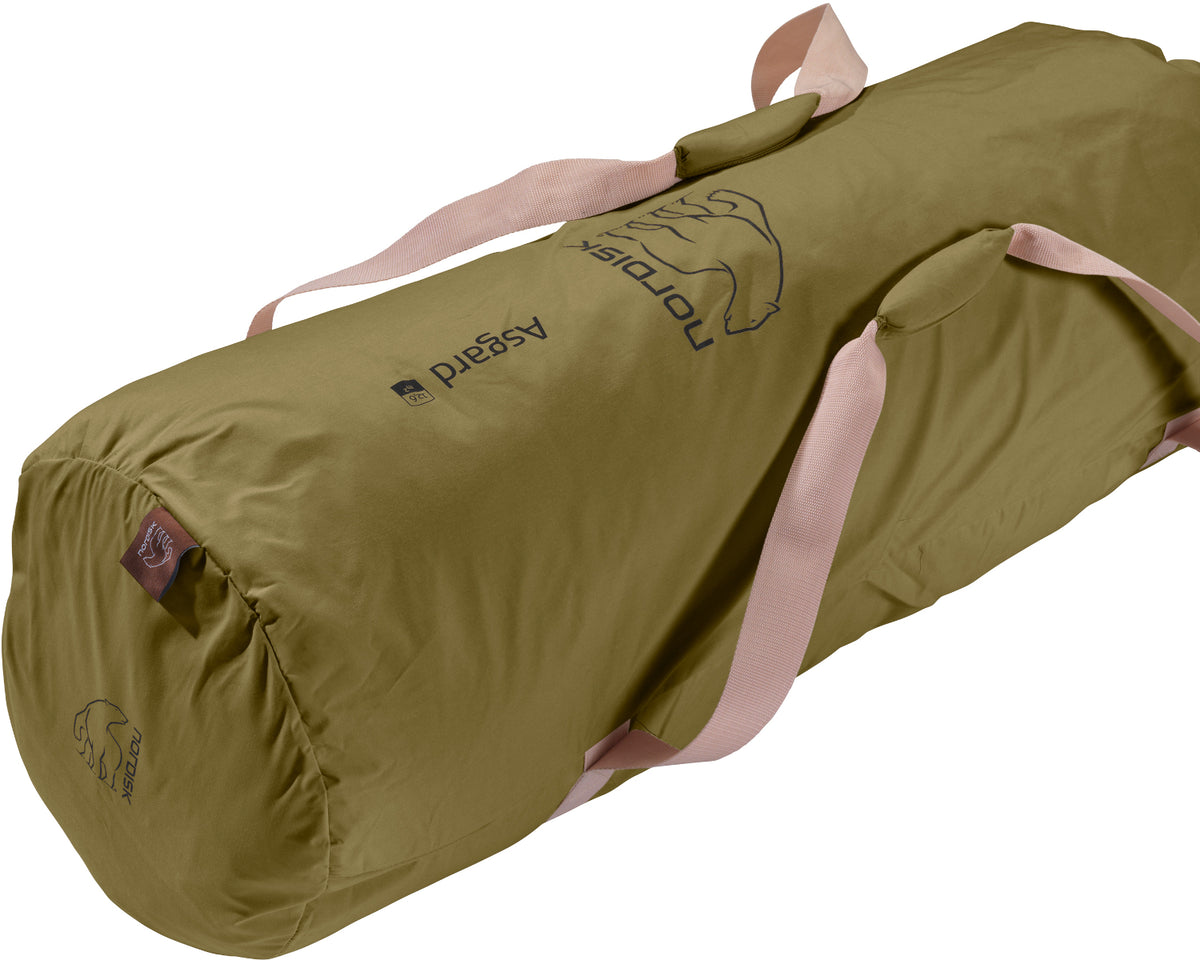 Green sleeping bag with pink interior on a white background