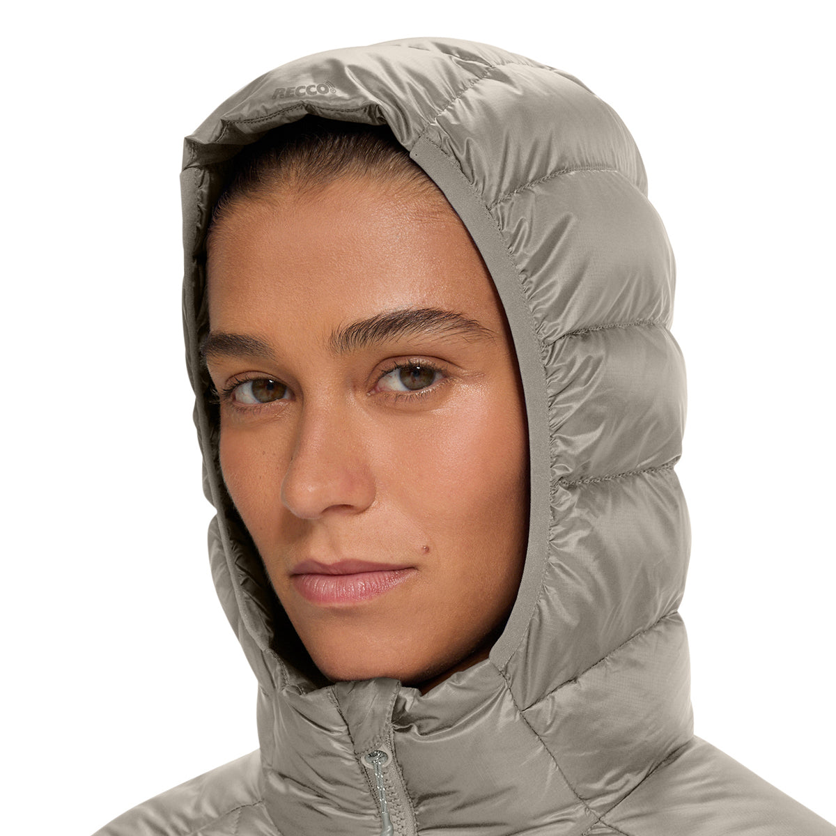 Close-up of a person wearing a light gray hooded puffer jacket against a plain white background.