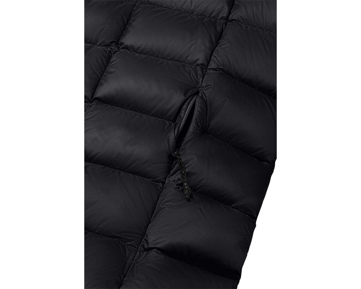 Close-up of a black puffer jacket with quilted texture on a white background