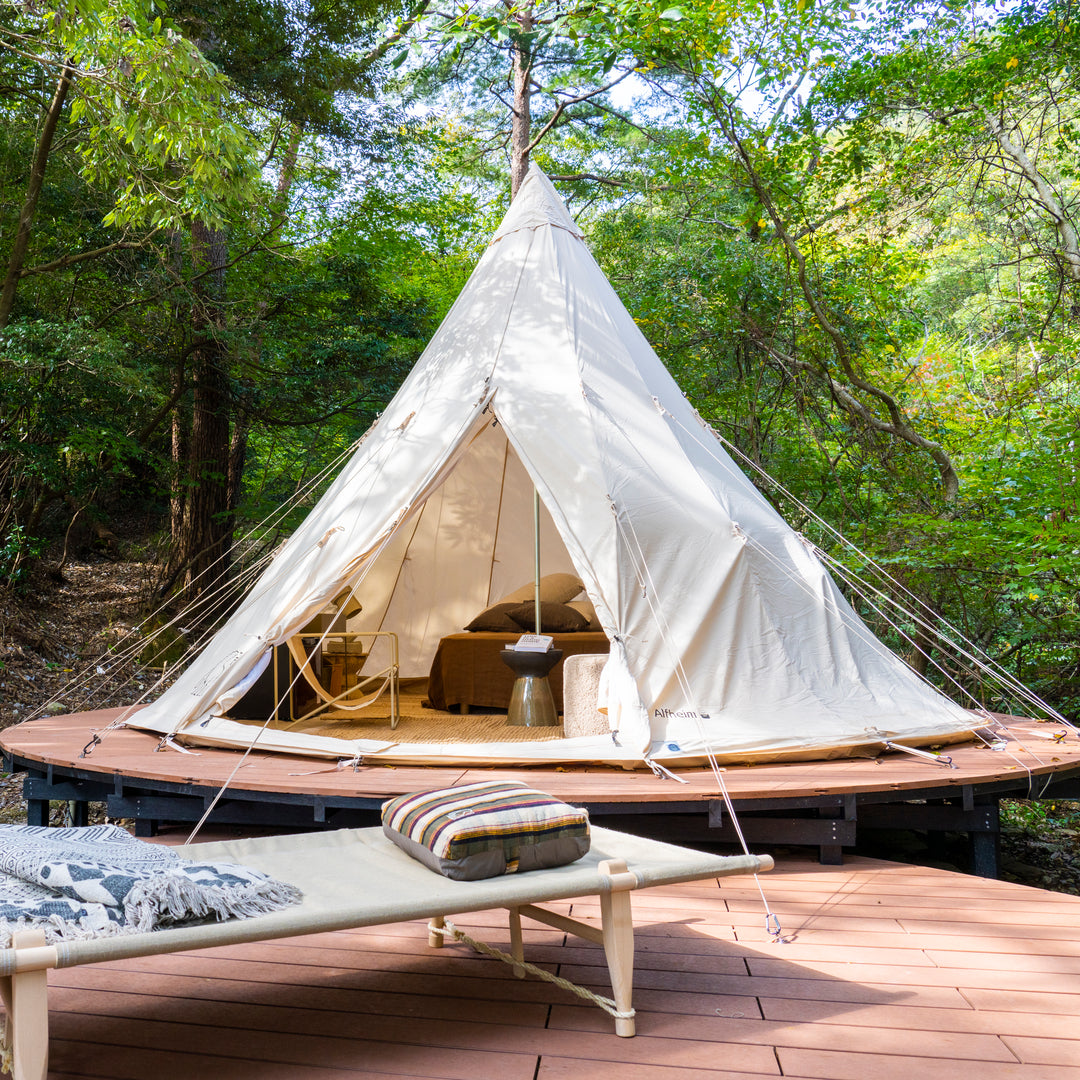 Glamping tepee tent on a wooden platform at Nordisk Hygge Circles Ugakei in Japan.