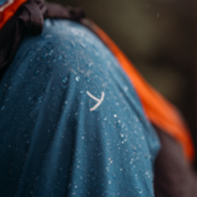 Close up of water repellent Yeti outdoor clothing with the signature Y logo.
