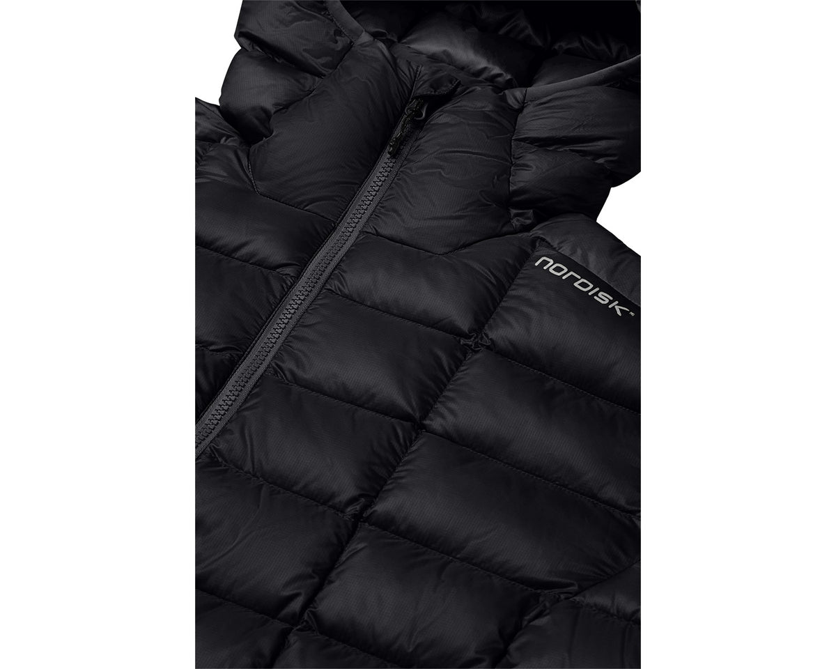 Close-up of a black puffer jacket with 'nordisk' branding on a white background