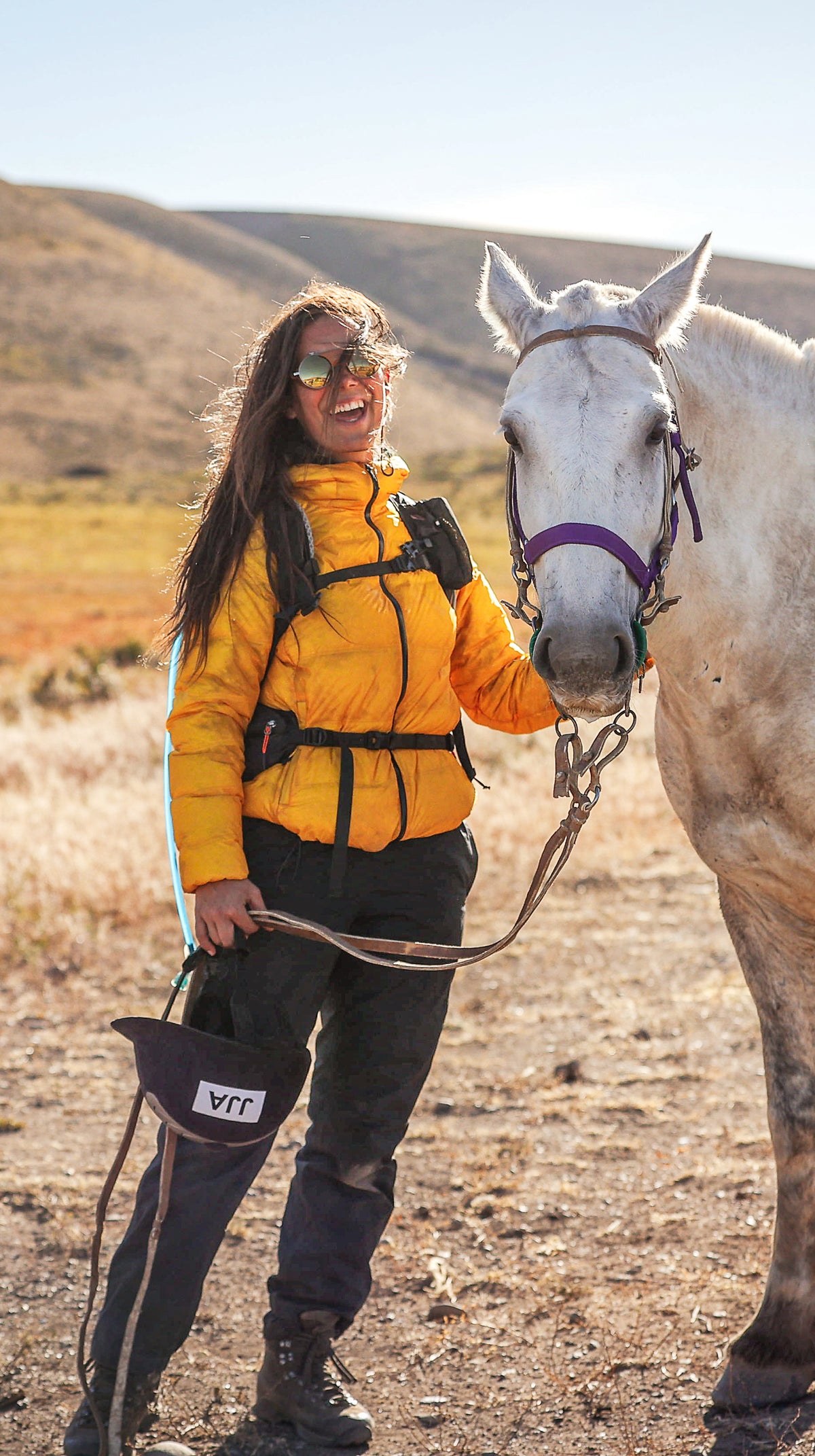 Nordisk hero Joséphine Jammaers posing with a white horse during an outdoor adventure.