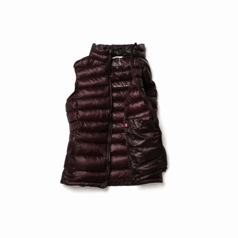 Companyon down vest being packed into its own pocket