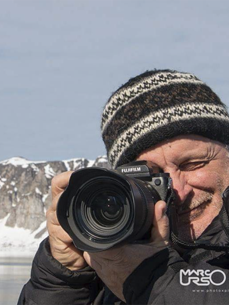 Marco Urso, Nordisk Hero and wildlife photographer, taking photos in a snowy mountain landscape.